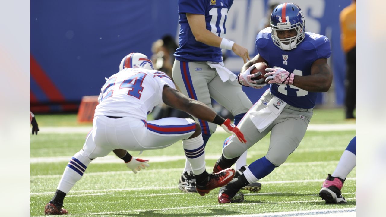 Buffalo Bills quarterback Doug Flutie avoids a tackle from New