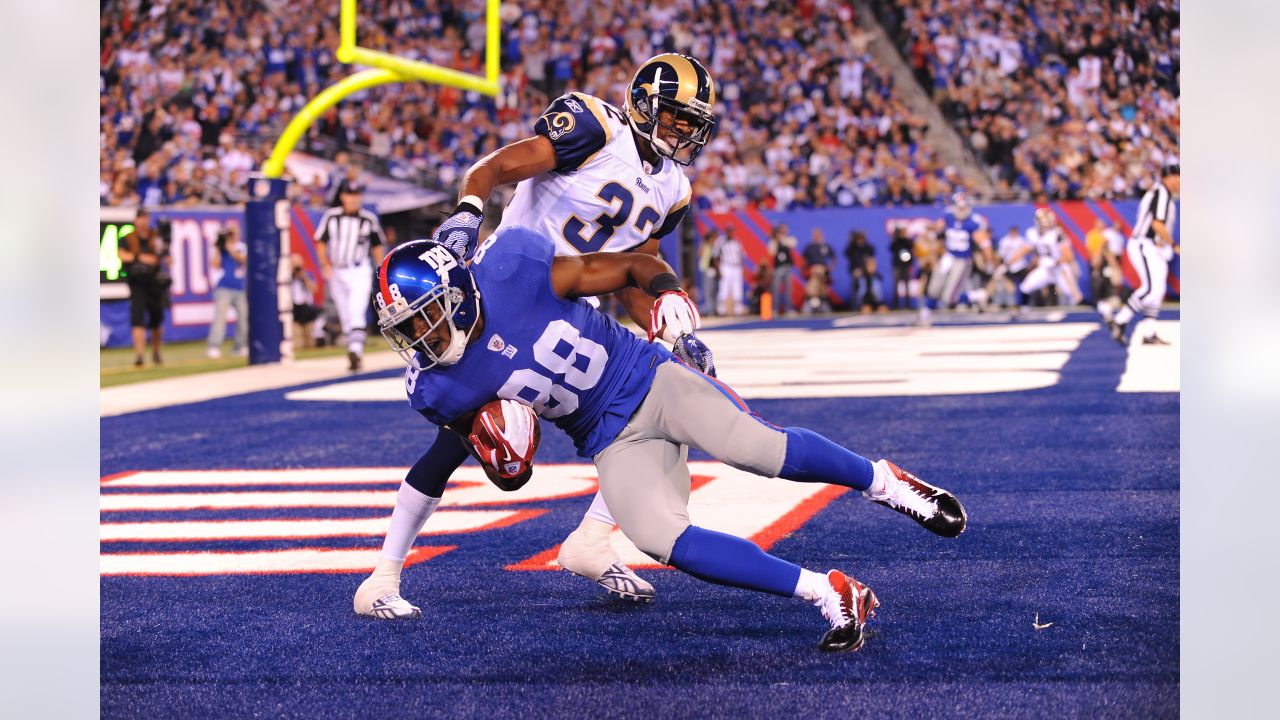 Rams' running back John Cappelletti, the former Heisman winner, is dragged  down by a shirt tackle as he tried to circle the New York Giants' left side  in Los Angeles Sunday, Sept.