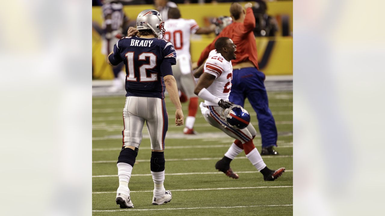 Defensive back Derrick Martin (22) of the New York Giants celebrates with  kids on the field at the end of Superbowl XLVI at Lucas Oil Stadium in  Indianapolis, Indiana on February 05