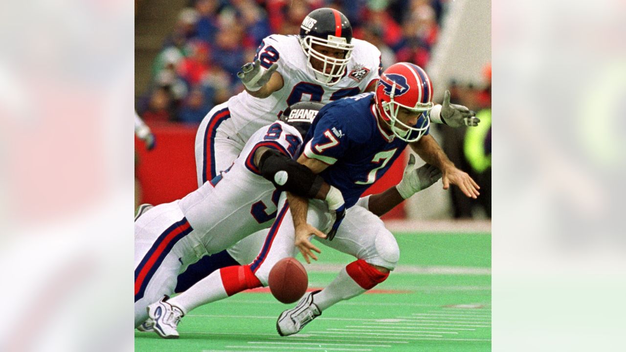 Buffalo Bills quarterback Doug Flutie scrambles toward the end