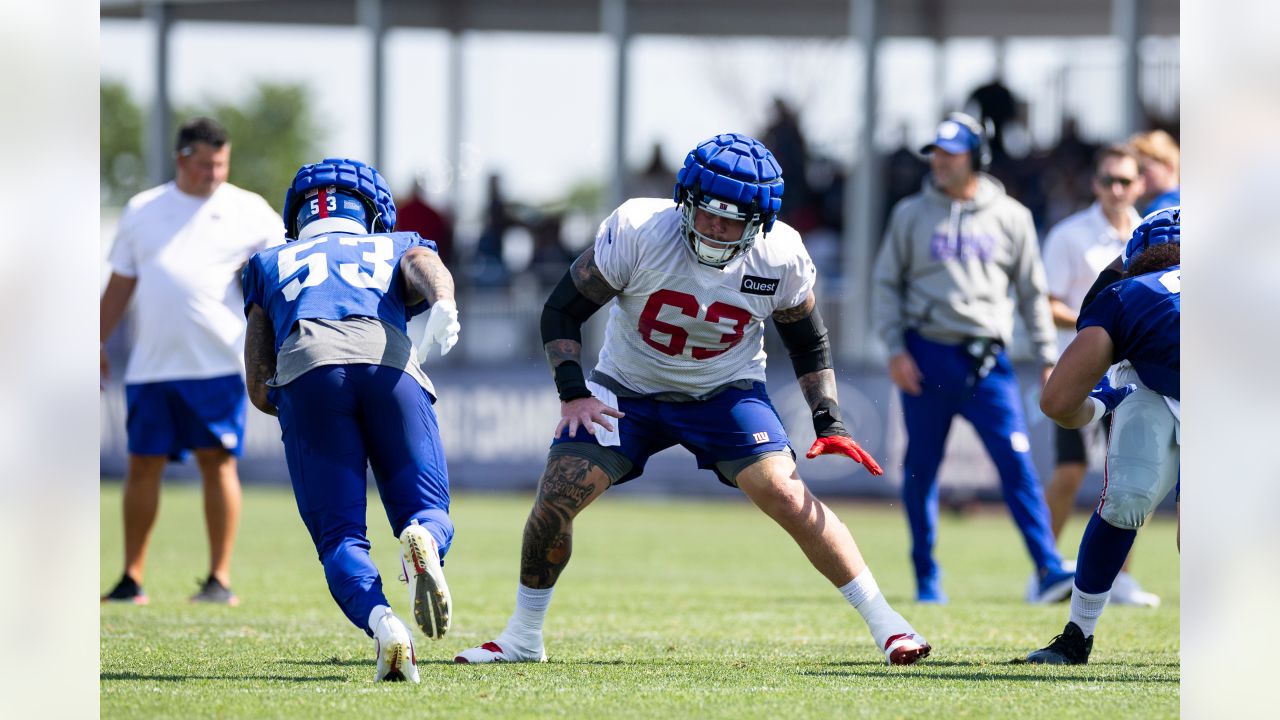 New York Giants tackle Evan Neal #73 walks off the field after