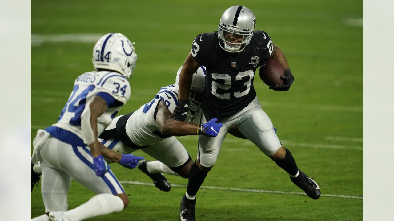 Miami Dolphins running back Malcolm Brown (34) scores a touchdown against  the Las Vegas Raiders during the first half of an NFL football game,  Sunday, Sept. 26, 2021, in Las Vegas. (AP