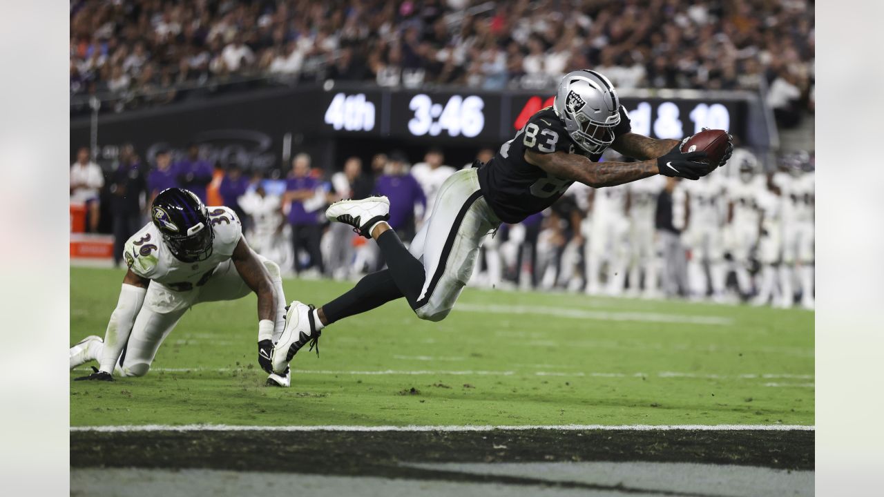 Oakland Raiders tight end Darren Waller runs the ball during an NFL  football game against the D …