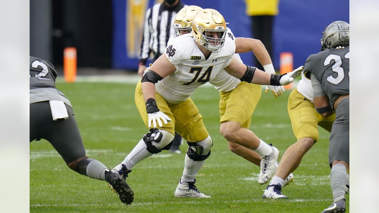 Miami Dolphins offensive tackle Liam Eichenberg (74) and offensive tackle Robert  Hunt (68) walk onto the field during the second half of an NFL football  game against the New York Jets, Sunday