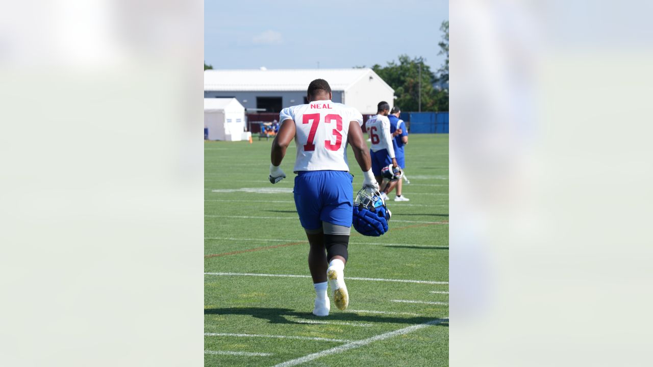 New York Giants tackle Evan Neal #73 walks off the field after