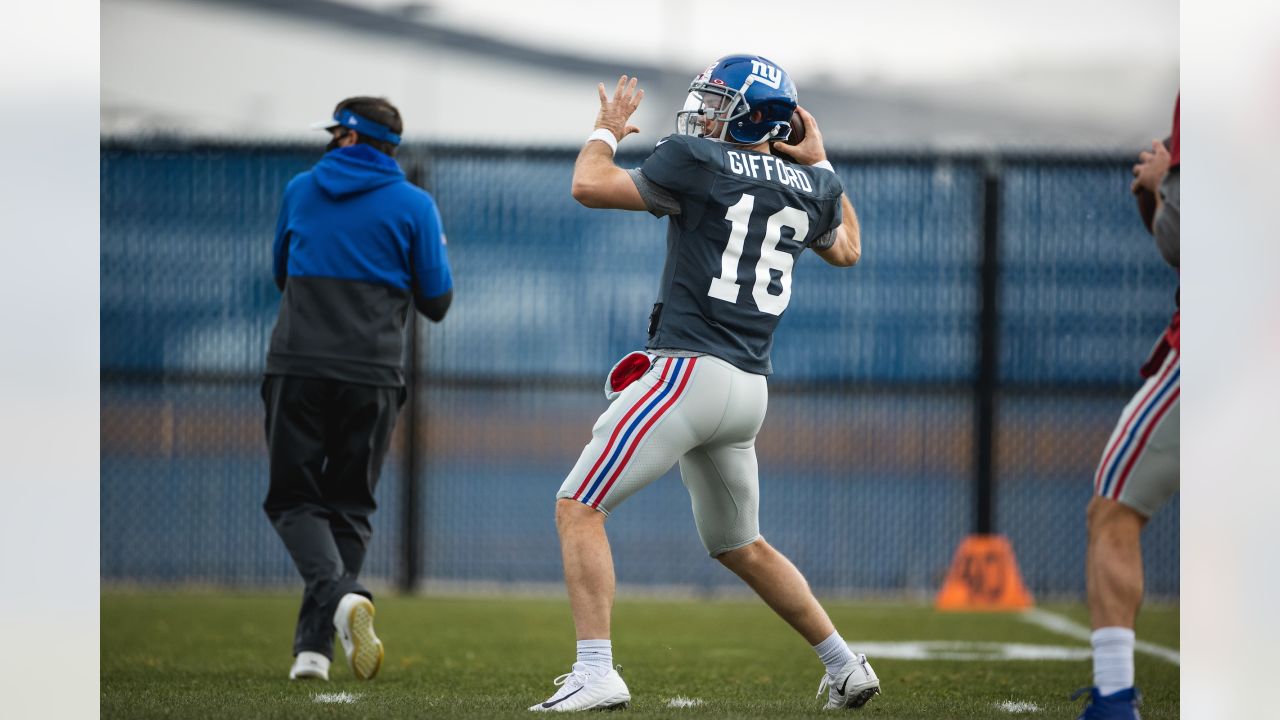 New York Giants defensive lineman Austin Johnson celebrates with  quarterback Colt McCoy (12) af …