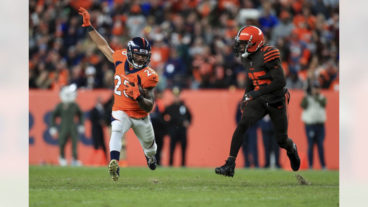 Seattle Seahawks running back Chris Carson (32) rushes against the  Cleveland Browns defensive back Jermaine Whitehead (35) during the second  half of an NFL football game, Sunday, Oct. 13, 2019, in Cleveland. (