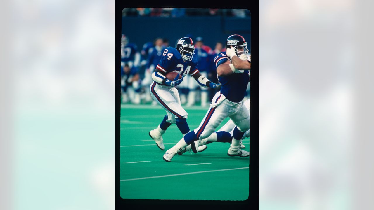 New York Giants alumni Phil Simms (left) and Michael Stahan (right) chat  during their induction to the Giants' ''Ring of Fame'' during halftime of  the New York Giants and Chicago Bears game