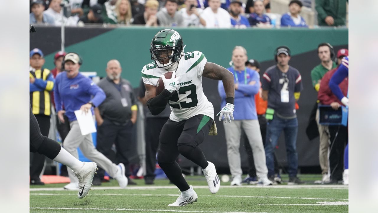 New York Jets' James Robinson (23) dives past Buffalo Bills' Tim