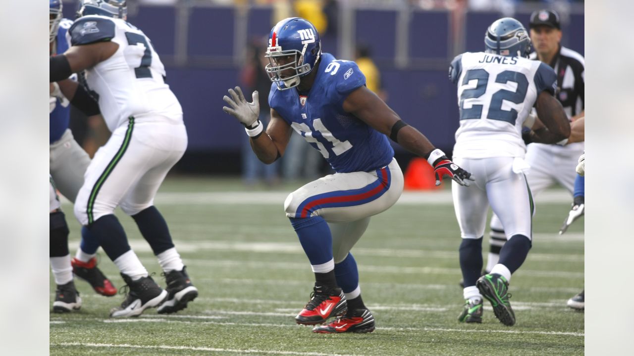 New York Giants defender Michael Strahan looks dejected while waiting on  the sidelines. The Detroit Lions defeated the New York Giants 28 to 13 at  Giants Stadium in East Rutherford, New Jersey