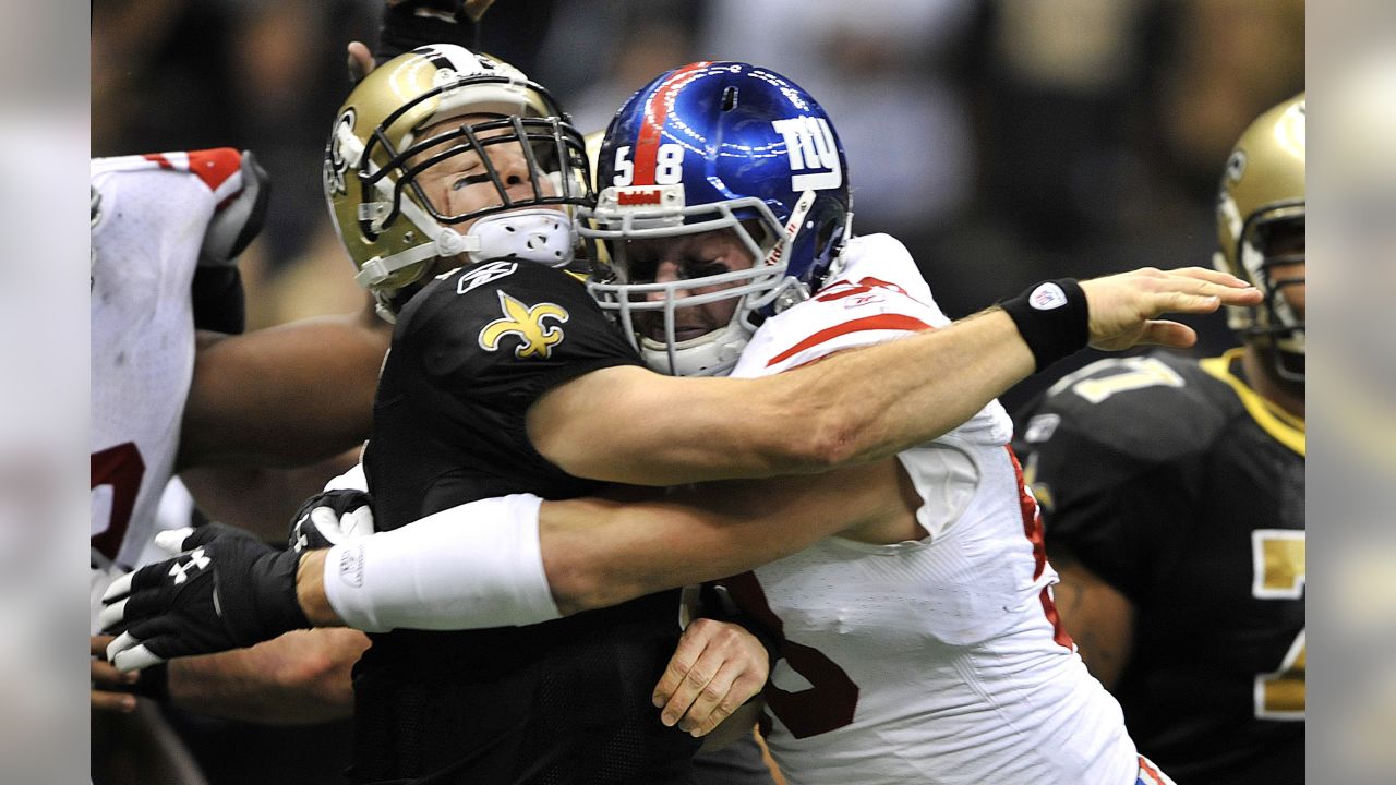 New Orleans Saints Drew Brees stretches on the sidelines before the game  against the New York Giants in week 4 of the NFL season at MetLife Stadium  in East Rutherford, New Jersey