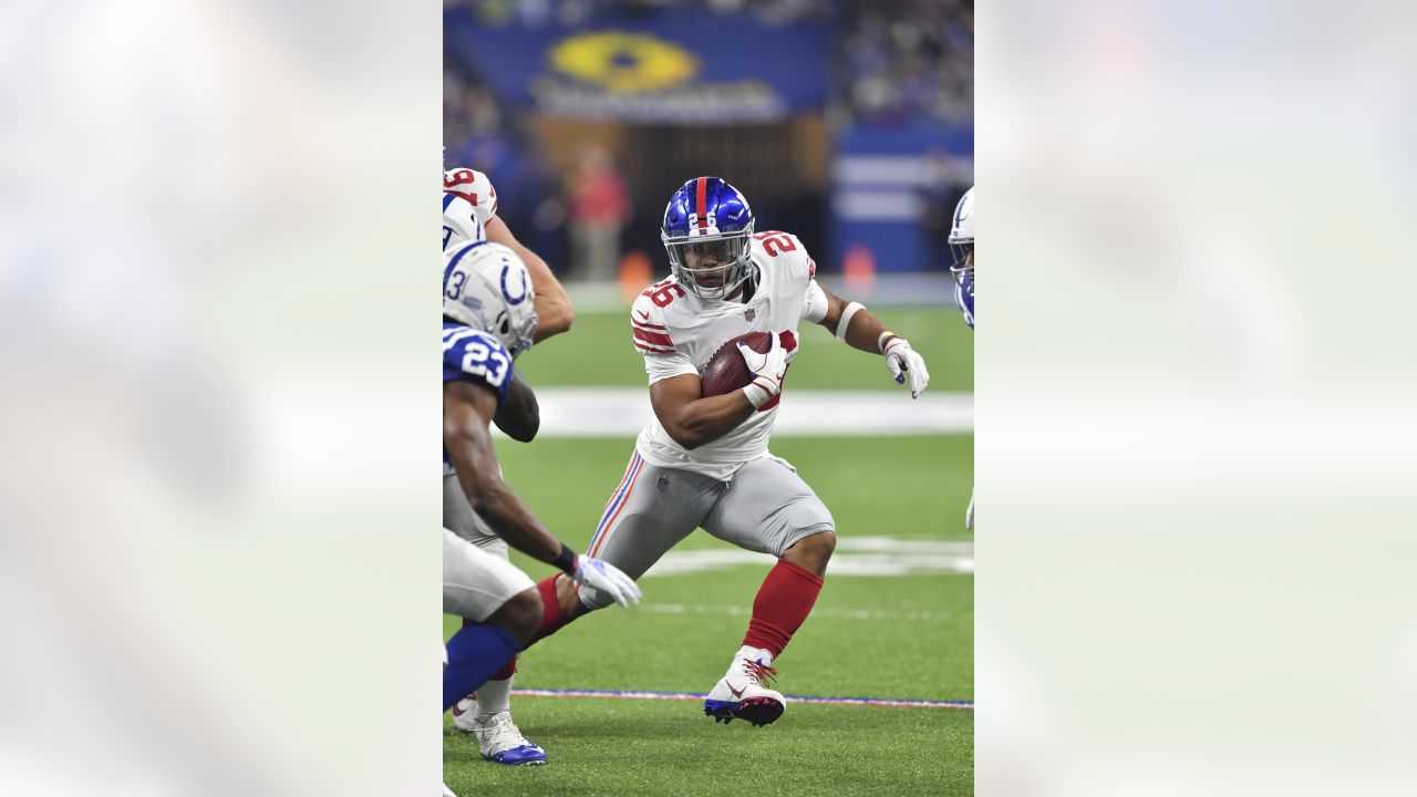 Indianapolis Colts cornerback Kenny Moore (23) tries to strip the ball from  New York Giants running back Saquon Barkley (26) during the first half of  an NFL football game in Indianapolis, Sunday, …