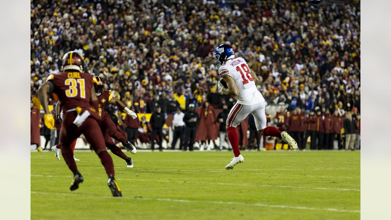 December 18 2022: New York Giants wide receiver Isaiah Hodgins (18) runs  the ball during the NFL game between the New York Giants and the Washington  Commanders in Landover, MD. Reggie Hildred/CSM/Sipa