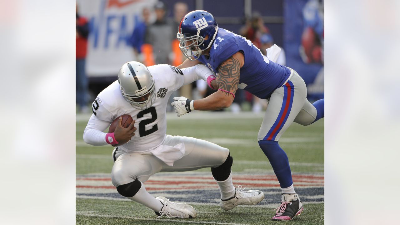 Oakland Raiders quarterback JaMarcus Russell runs out of the pocket in the  second quarter against the New York Giants in week 5 of the NFL season at  Giants Stadium in East Rutherford