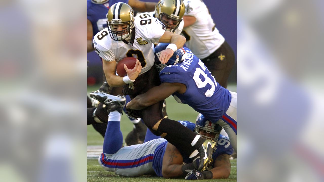 New Orleans Saints Drew Brees stretches on the sidelines before the game  against the New York Giants in week 4 of the NFL season at MetLife Stadium  in East Rutherford, New Jersey