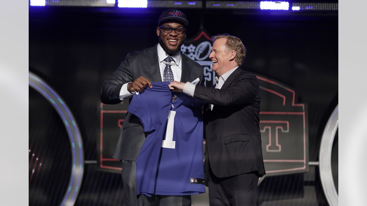 North Carolina State offensive tackle Ikem Ekwonu stands with NFL  Commissioner Roger Goodell after being picked by the Carolina Panthers with  the sixth pick of the NFL football draft Thursday, April 28