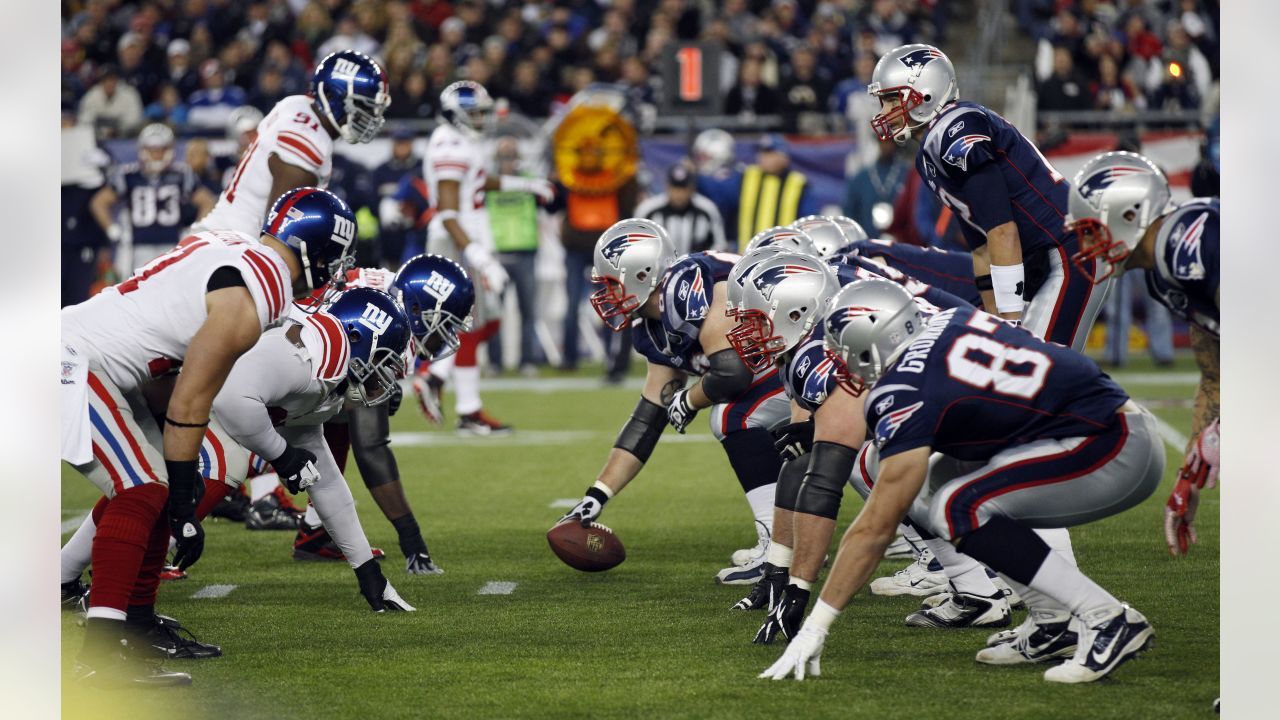 New England Patriots QB Tom Brady hands off to New England Patriots running  back Fred Taylor (21) in the second quarter against the Atlanta Falcons at  Gillette Stadium in Foxboro, Massachusetts on