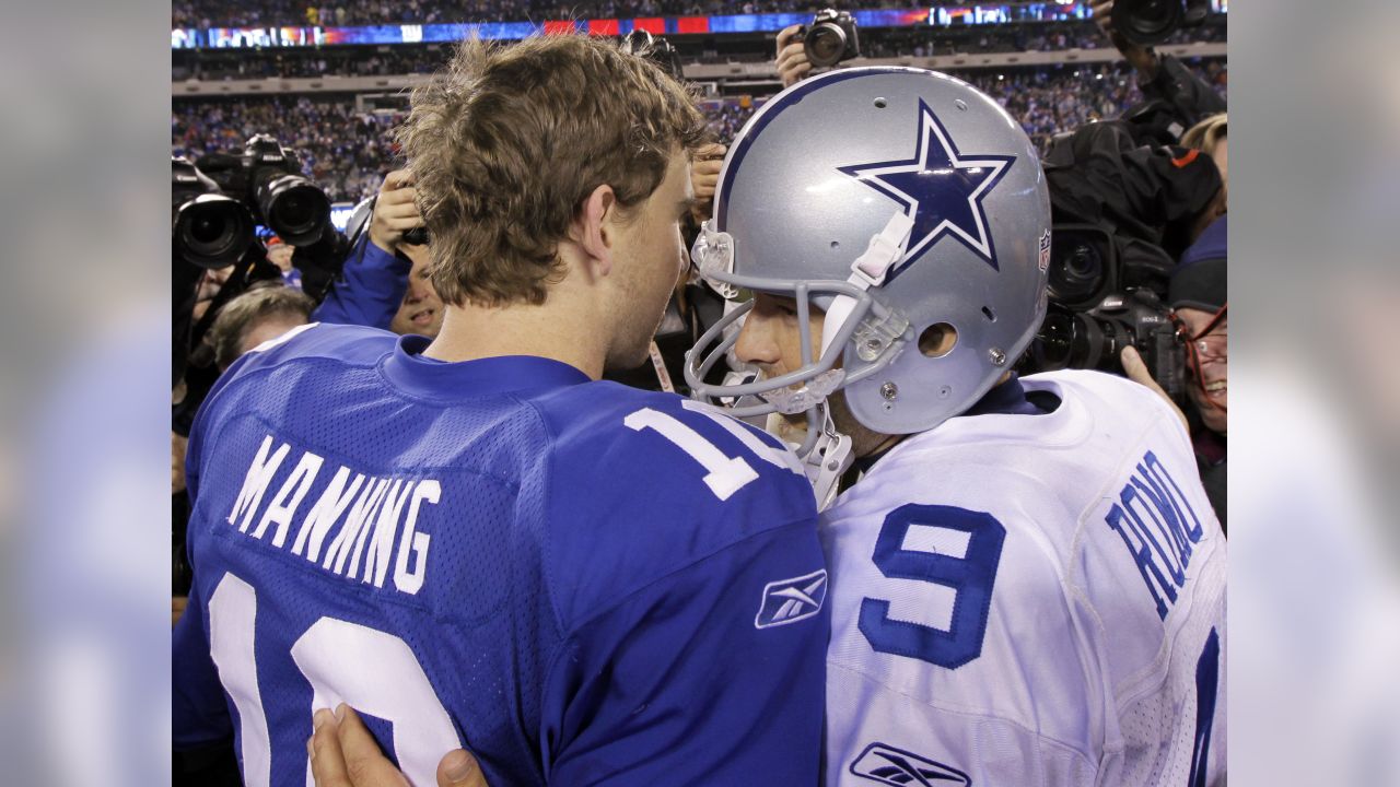 New York Giants quarterbacks Eli Manning and Kurt Warner celebrate on the  field after the game. The New York Giants defeated the Dallas Cowboys 28 to  24 at Giants Stadium in East