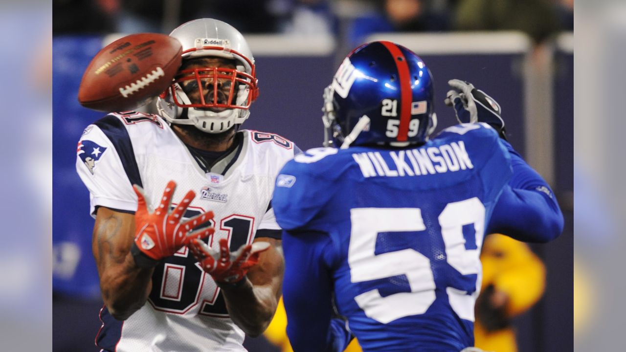 Tight end Aaron Hernandez (81) of the New England Patriots was unable to  catch this Tom Brady pass as he was defended by strong safety Deon Grant  (34) of the New York