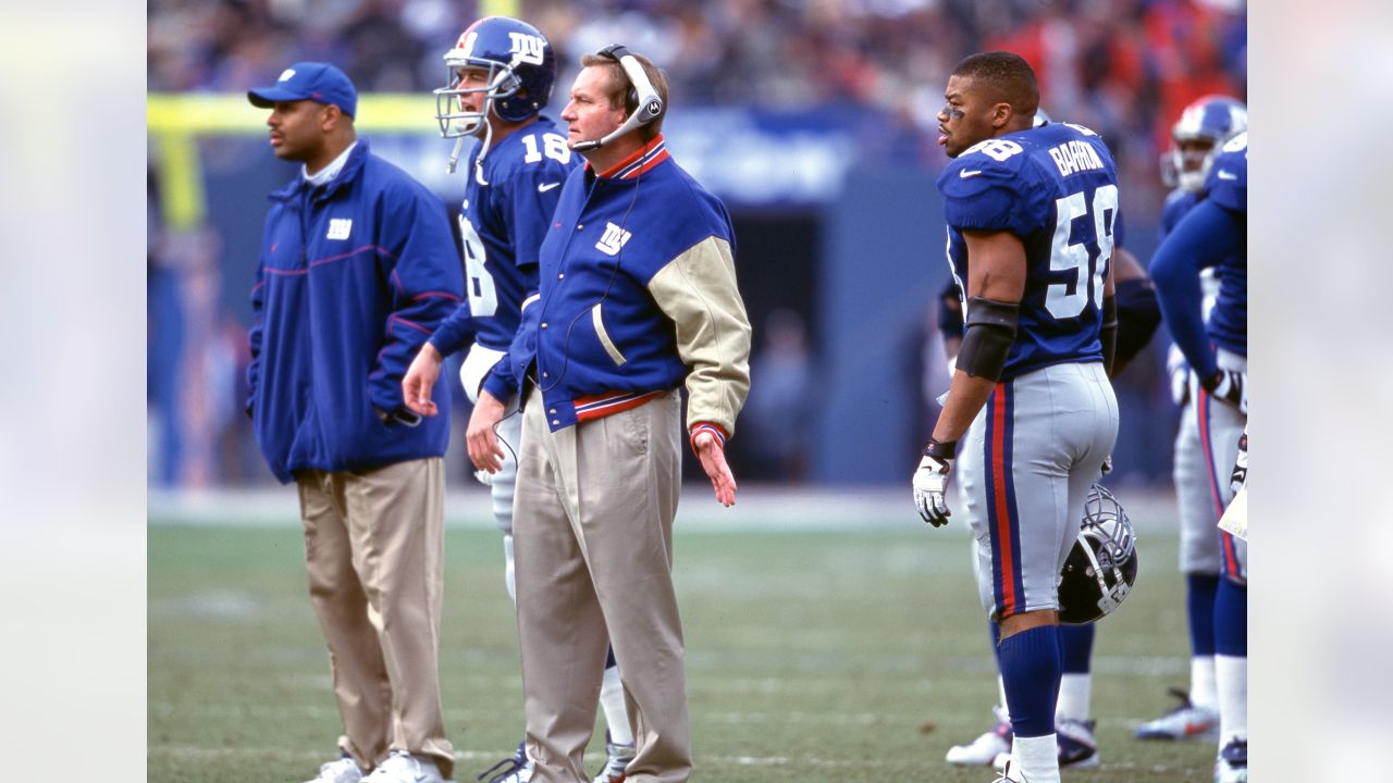 New York Giants head coach Jim Fassel wears his 2000 Super Bowl