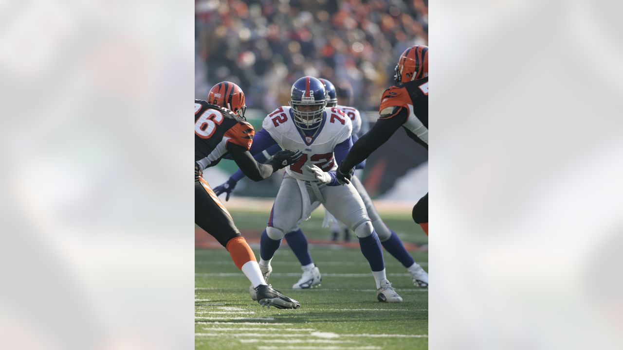 Cincinnati Bengals quarterback Jeff Black (8) hits the turf after being  tripped up by New York Giants Michael Strahan (92) during the second  quarter of their game at Giants Stadium in East