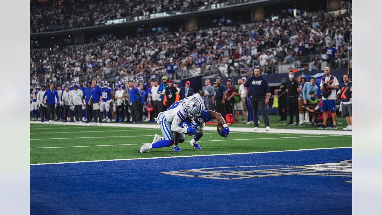 Dallas Cowboys' and Denver Broncos' kickers and other special-teams  players warm up prior to a National Football League game at the Cowboys'  home field AT&T Stadium in Arlington, Texas