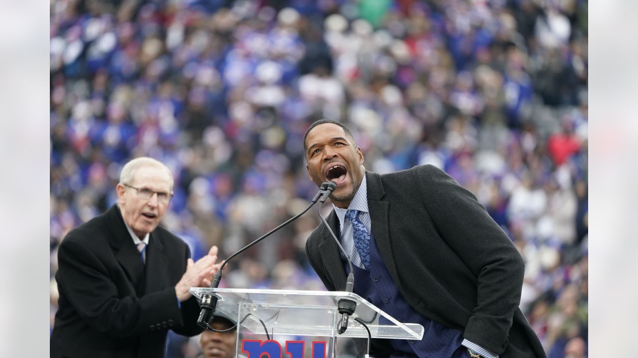 New York Giants Michael Strahan walks away from the podium after his  retirement press conference at Giants Stadium in East Rutherford, New Jersey  on June 6, 2008. Strahan retires after 15 years