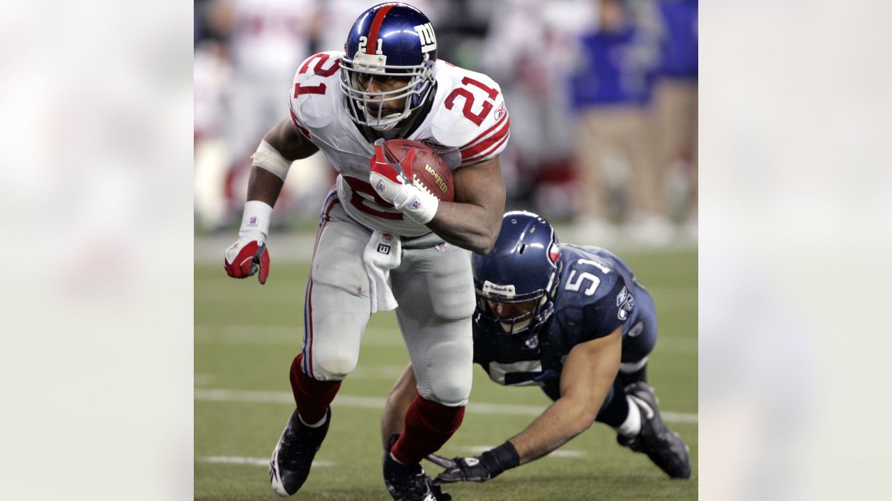 Rodney Hampton (27) of the New York Giants is tackled from behind for a  4-yard loss by Cortez Kennedy of the Seattle Seahawks during the second  quarter of NFL game at Giants