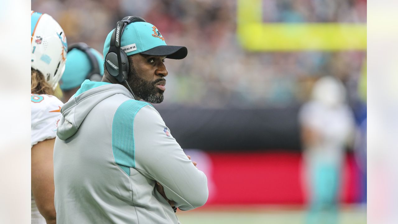 Los Angeles Chargers head coach Anthony Lynn, center, reacts on the  sideline after a replay is shown on a stadium video monitor during the  second half of an NFL football game against