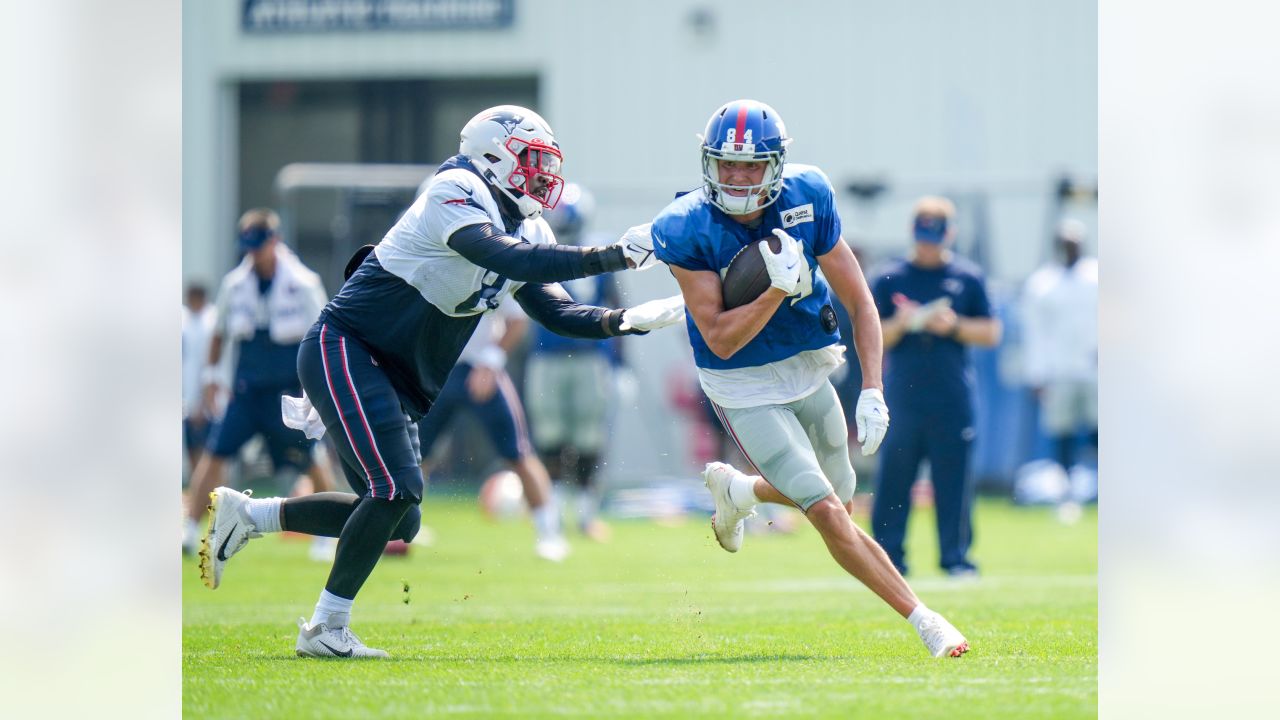 New York Giants running back Sandro Platzgummer makes a catch during a  joint NFL football practice with the New England Patriots, Thursday, Aug.  26, 2021, in Foxborough, Mass. (AP Photo/Steven Senne Stock