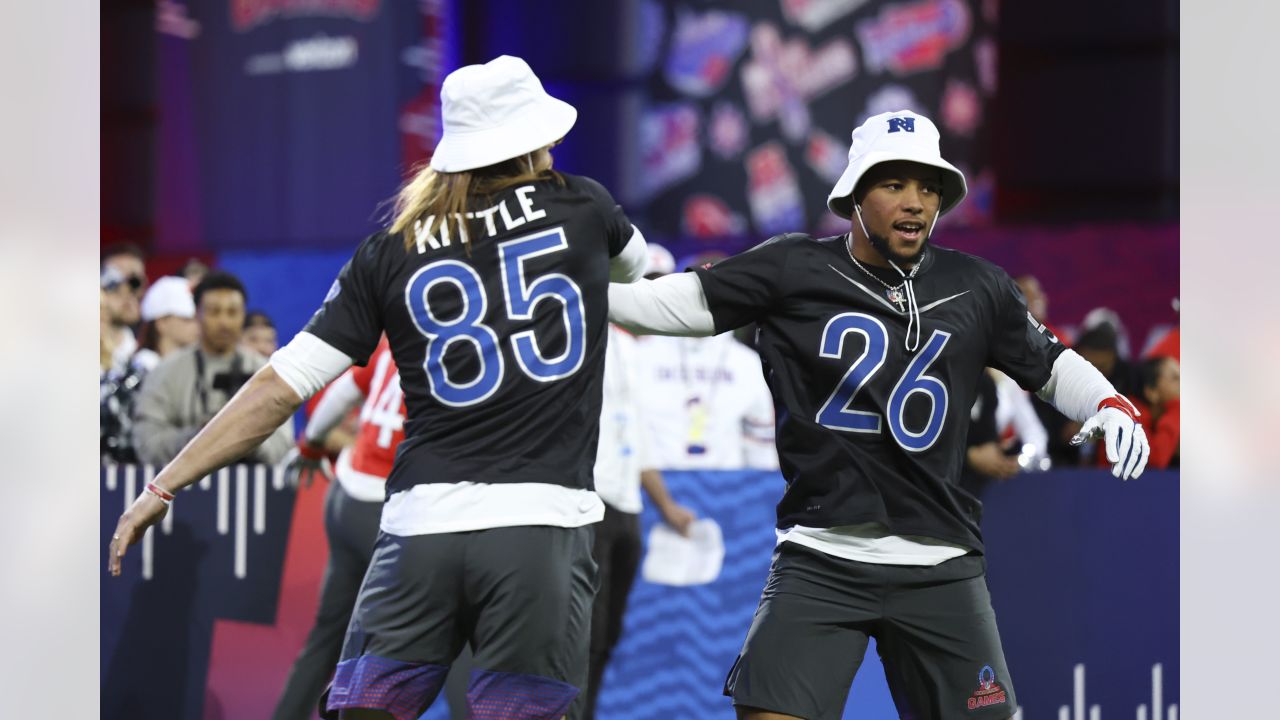 NFC tight end George Kittle (85) of the San Francisco 49ers celebrates a  touchdown with NFC wide receiver Justin Jefferson of the Minnesota Vikings  during the flag football event at the NFL