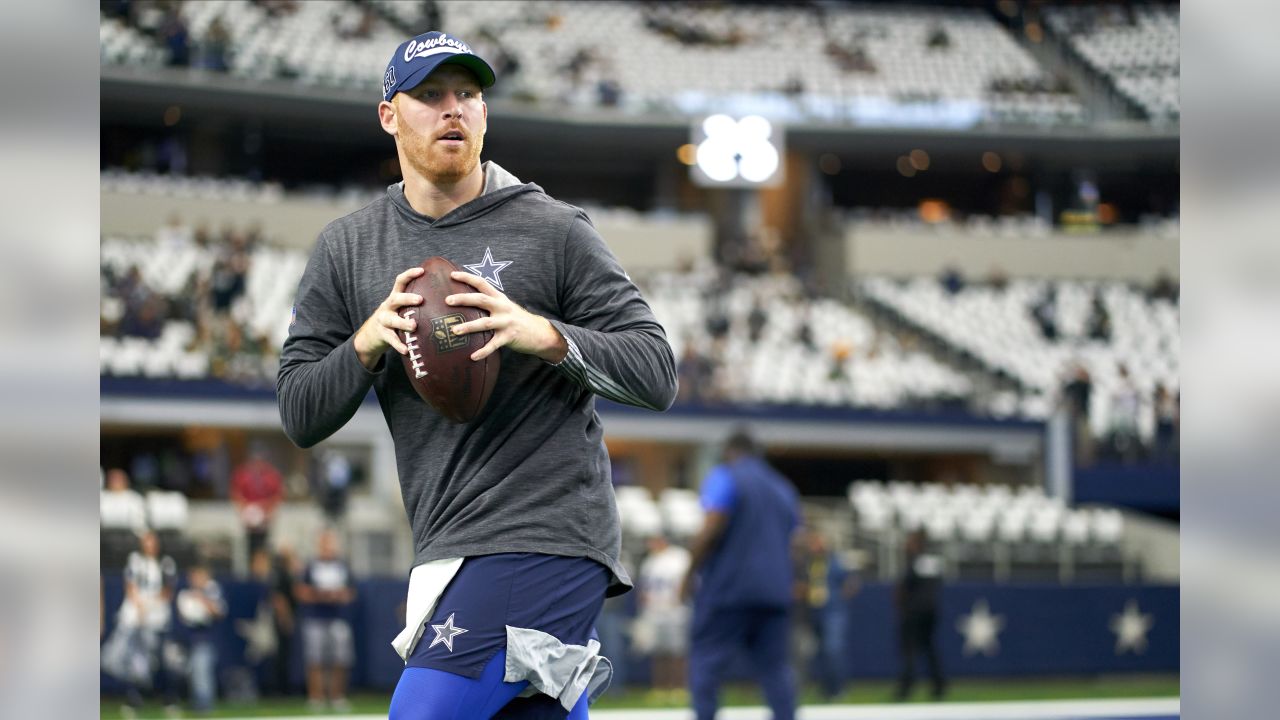 Dallas Cowboys quarterback Cooper Rush warms up before the game