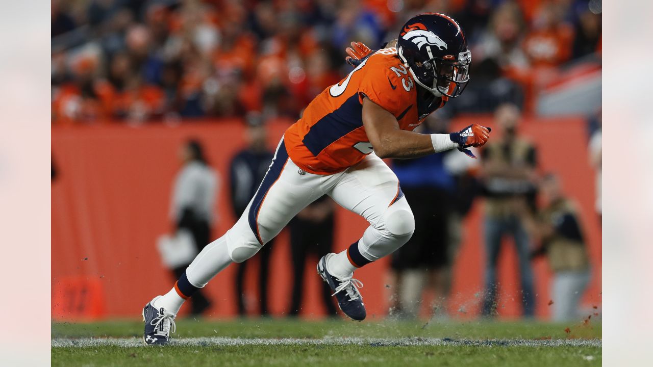 Denver running back Devontae Booker runs down field to the Oakland 25-yard  line during the second quarter Sunday, Jan. 1, 2017, at Sports Authority  Field at Mile High in Denver. (The Gazette