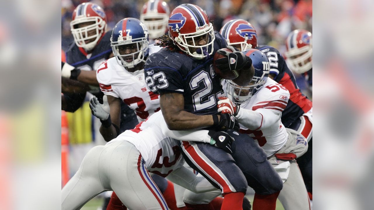 Buffalo Bills Ryan Fitzpatrick (14) hands off to Marshawn Lynch (23) in  this NFL football game between the Buffalo Bills and Jacksonville Jaguars  at Municipal Stadium in Jacksonville, Florida. The Jaguars defeated