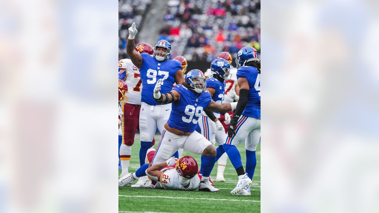 New York Giants fullback Elijhaa Penny (39) and defensive back Steven  Parker (38) react after a defensive play against the Washington Football  Team during the first quarter of an NFL football game, Sunday, Jan. 9,  2022, in East Rutherford, N.J. (AP Pho