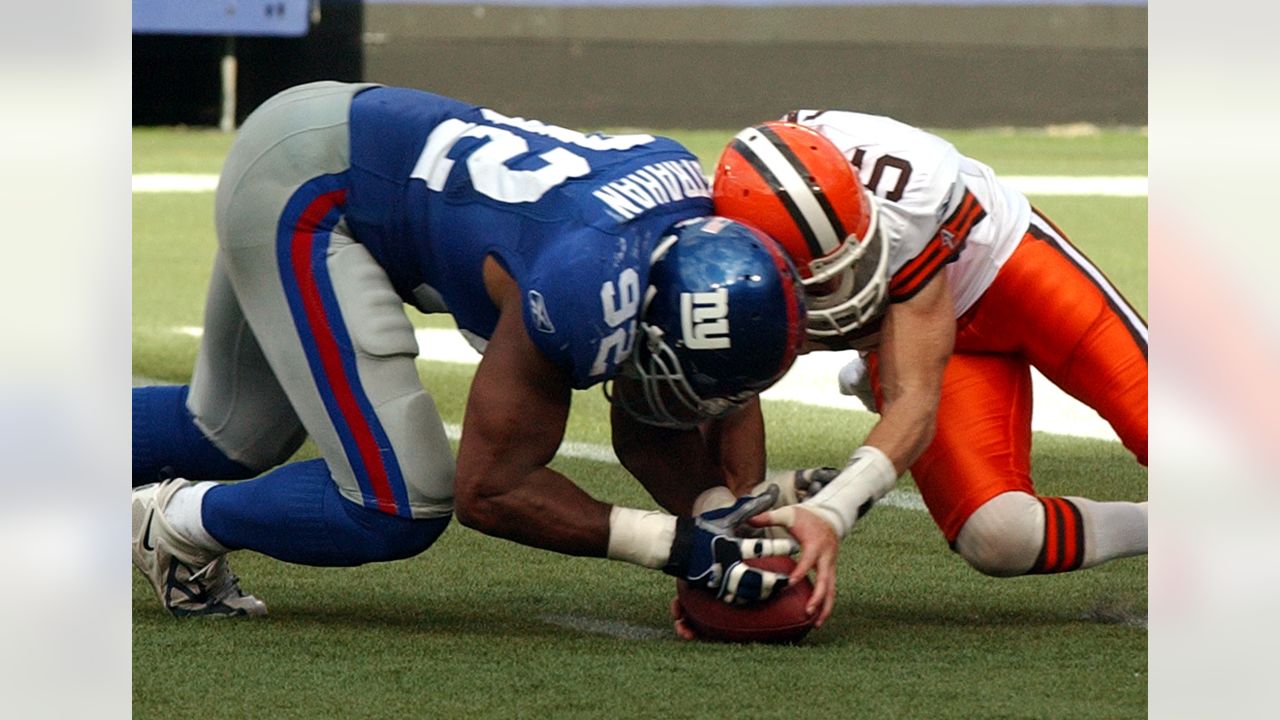 Guard Andy Gross (64) of the New York Giants reaches for an elusive pigskin  fumbled by Cleveland Browns Carl Ward (27) during a return of Giants  kickoff in the third quarter at