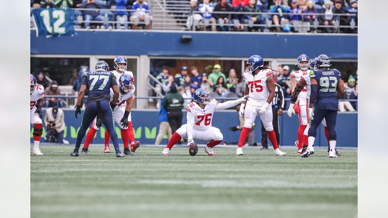 New York Giants quarterback Daniel Jones (8) passes against Seattle  Seahawks linebacker Uchenna Nwosu (10) as offensive tackle Andrew Thomas,  second from right, blocks defensive end Shelby Harris (93) during the second