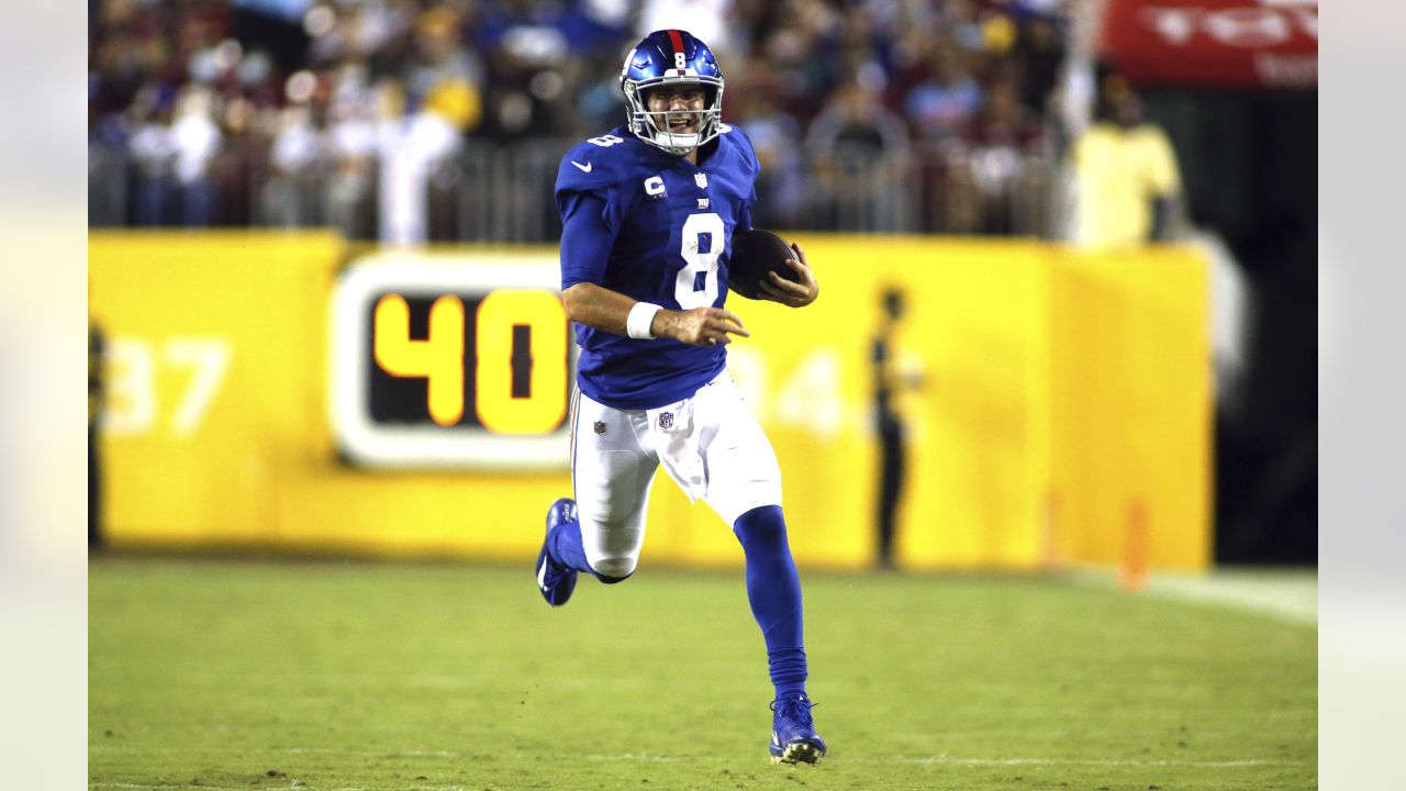 New York Giants quarterback Daniel Jones (8) runs downfield with the ball  during the first half of an NFL football game against the Washington  Football Team, Thursday, Sept. 16, 2021, in Landover