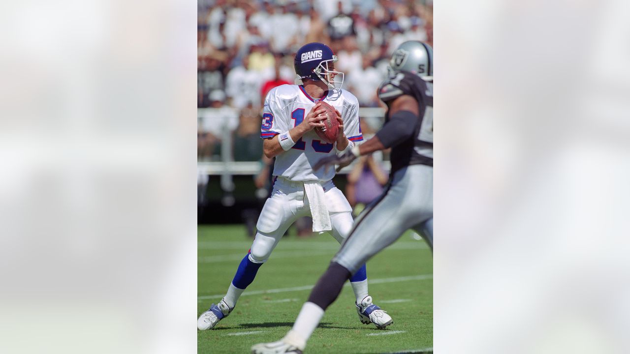 Quarterback Jim Plunkett of the Oakland Raiders drops back to pass