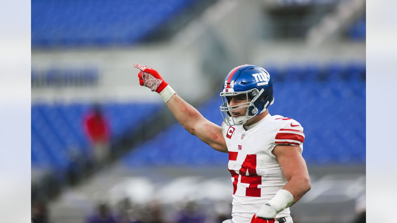 Baltimore, United States. 27th Dec, 2020. New York Giants quarterback  Daniel Jones (8) leaves the field with tight end Kaden Smith (82) after a  game against the Baltimore Ravens at M&T Bank