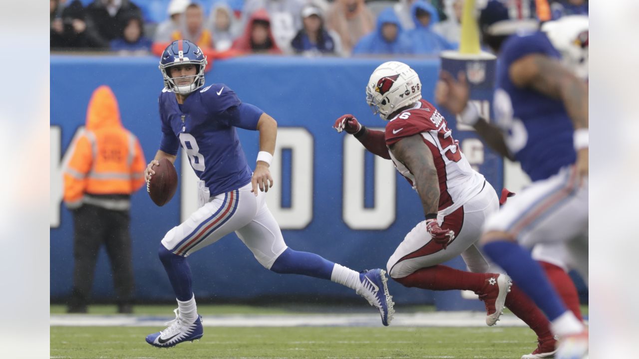 Fran Tarkenton, New York Giants quarterback, shows why he is known for his  scrambling finesse as he evades Cardinals in first quarter of game and  prepares to throw a pass in New