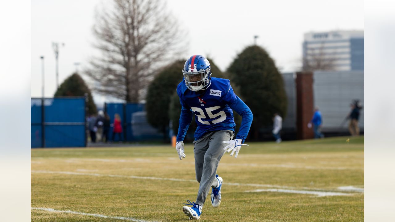 New York Giants Michael Strahan points his finger in the air and winks  while walking off of the field in week 13 at Giants Stadium in East  Rutherford, New Jersey on December