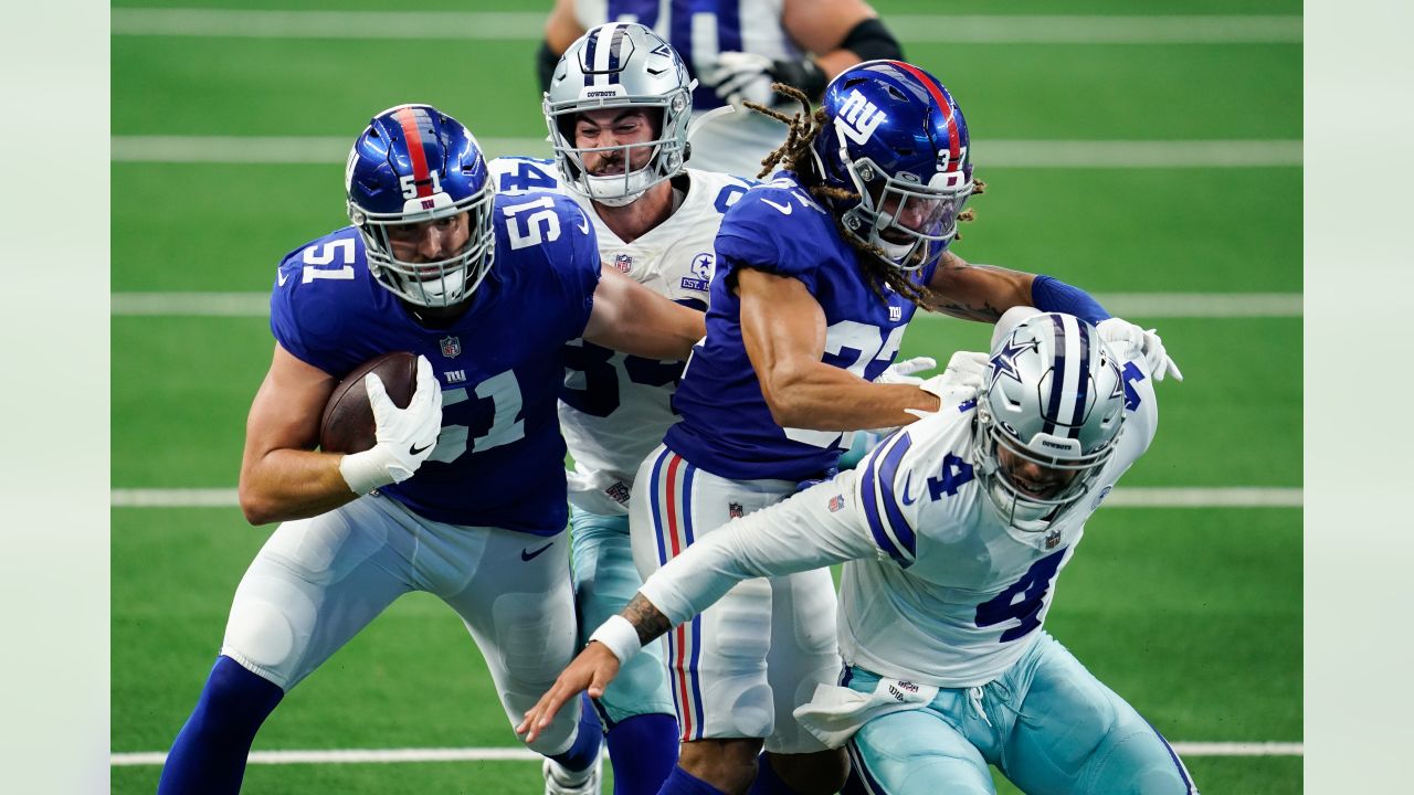 New York Giants linebacker Lorenzo Carter (59) celebrates intercepting a  Dallas Cowboys' Dak Prescott pass in the first half of an NFL football game  in Arlington, Texas, Sunday, Oct. 10, 2021. (AP