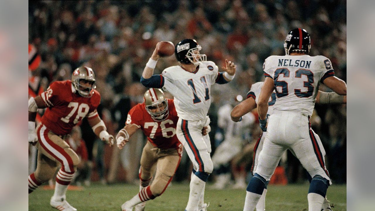 New York Giants Phil McConkey hauls in a 28-yard pass from quarterback Phil  Simms in the end zone as San Francisco 49ers Tim McKyer hangs on during  third quarter action at Giants