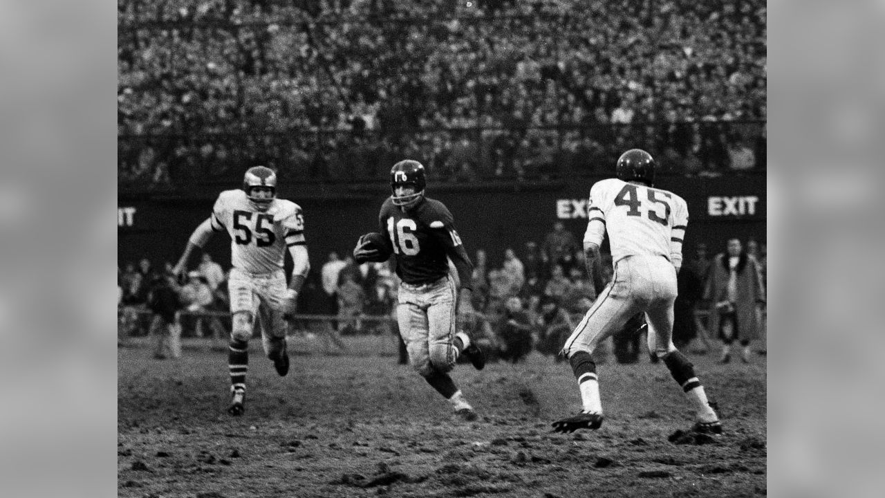 Chicago Cardinals halfback Ken Hall, center, is dragged down after a gain of  8 yards in the first period of a Cards Philadelphia Eagles pro-football  game, Nov. 15, 1959, Philadelphia, Pa. Pulling