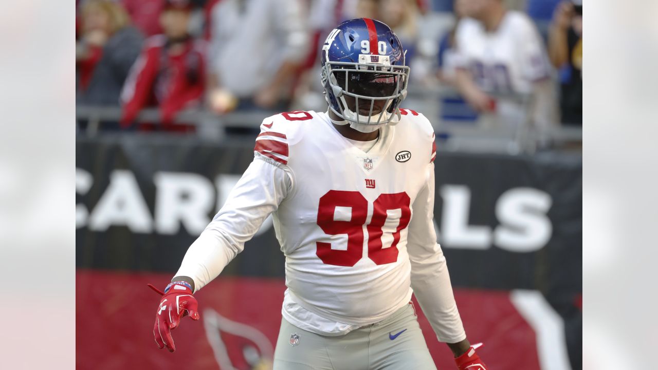 New York Giants defensive end jason Pierre-Paul stands over a fallen New  England Patriots quarterback Tom Brady during the fourth quarter at Super  Bowl XLVI at Lucas Oil Stadium on February 5