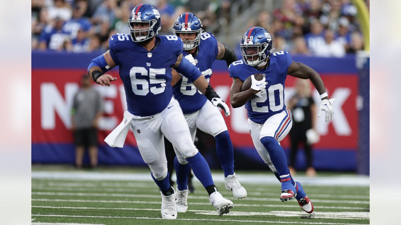 New York Giants running back Eric Gray (20) runs the ball during the first  half of an NFL preseason football game against the New York Jets, Saturday,  Aug. 26, 2023, in East