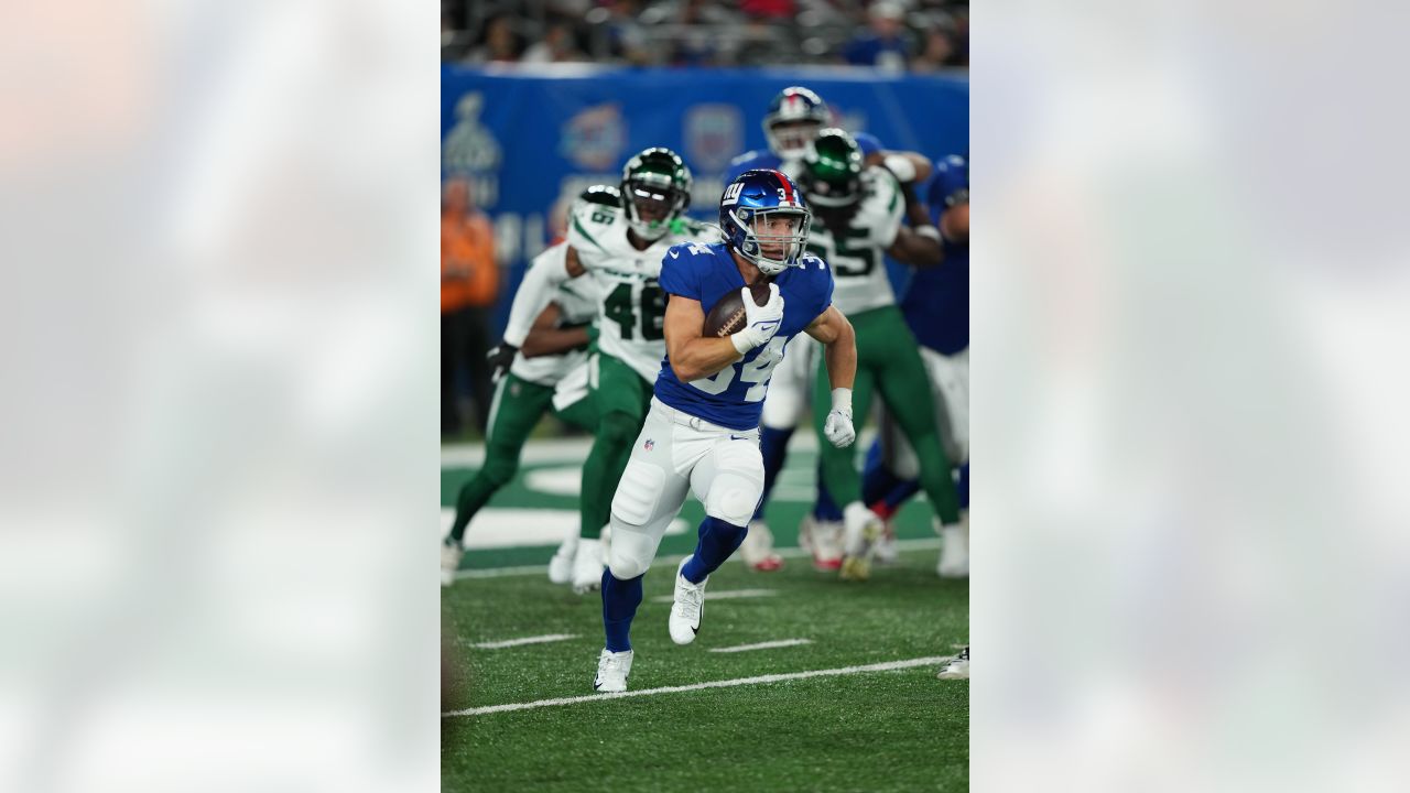 New York Giants running back Sandro Platzgummer (34) warms up