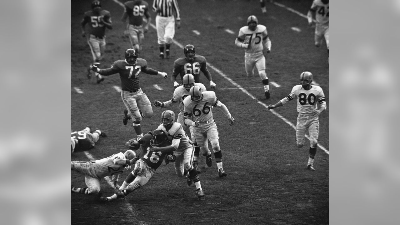 December 30, 1962: The Giants try to keep warm as they play the