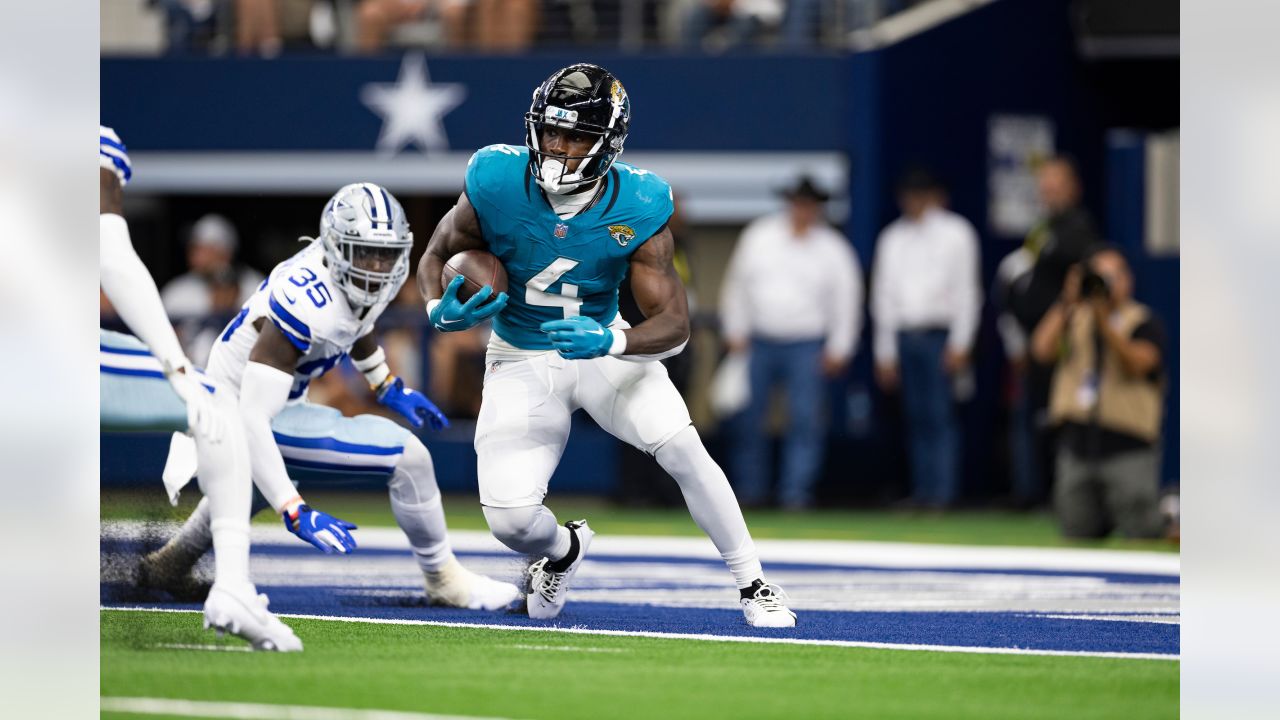 Jacksonville Jaguars running back Tank Bigsby (4) enters the field for an  NFL pre-season football game against the Miami Dolphins, Saturday, Aug. 26,  2023, in Jacksonville, Fla. The Jaguars defeated the Dolphins